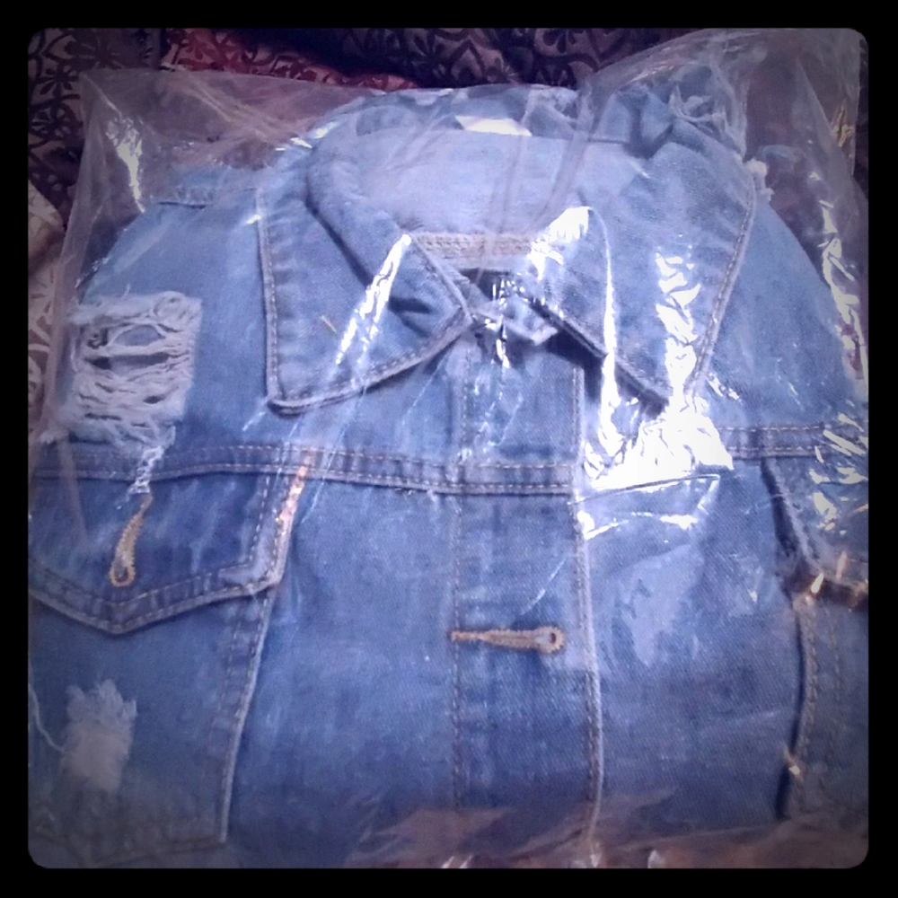 Brand new Long jean dress with holes in the back